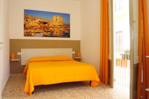 A bed or beds in a room at Le Sette Meraviglie