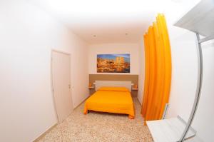 A bed or beds in a room at Le Sette Meraviglie