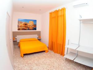 A bed or beds in a room at Le Sette Meraviglie