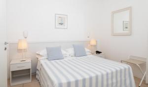 Postel nebo postele na pokoji v ubytování Hotel Plaza Esplanade