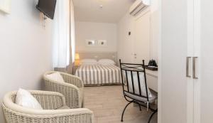 Postel nebo postele na pokoji v ubytování Hotel Plaza Esplanade
