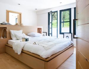 Ένα ή περισσότερα κρεβάτια σε δωμάτιο στο Domaine de Bramafam