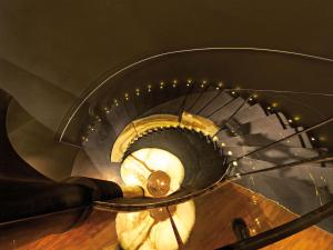 a spiral staircase in a building with a spiral at DO&CO Hotel Vienna in Vienna