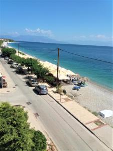 an aerial view of a beach with cars parked at Mondo Cosseri Akrata in Akrata