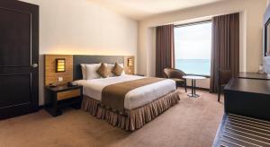 Postel nebo postele na pokoji v ubytování Bayview Hotel Georgetown Penang + 23 fotografií