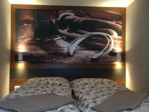 A bed or beds in a room at Hotel U koně