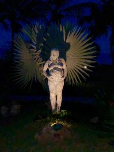 a statue of an angel with its wings out at Mar Doce Boutique Hotel in Três Marias