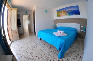A bed or beds in a room at Le Sette Meraviglie