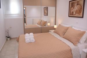 Posteľ alebo postele v izbe v ubytovaní Keratea Apartment Athens Airport