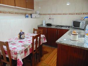 a kitchen with a table with a table cloth on it at AzoresDream in Velas