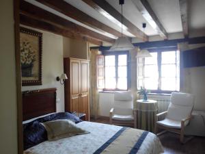 Cama ou camas em um quarto em Posada Montero de la Concha