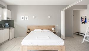 Postel nebo postele na pokoji v ubytování Afkos Apartments