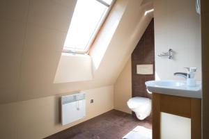 Kúpeľňa v ubytovaní Apartamenty Rodzinne II ApartZakop