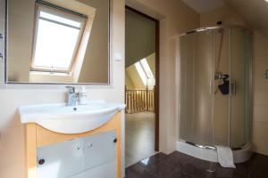 Kúpeľňa v ubytovaní Apartamenty Rodzinne II ApartZakop