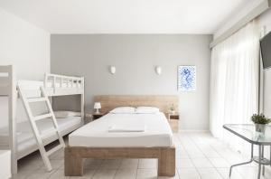 Postel nebo postele na pokoji v ubytování Afkos Apartments