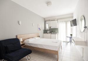 Postel nebo postele na pokoji v ubytování Afkos Apartments