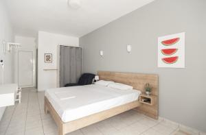 Postel nebo postele na pokoji v ubytování Afkos Apartments