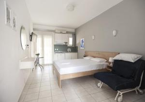 Postel nebo postele na pokoji v ubytování Afkos Apartments