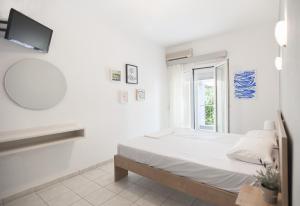 Postel nebo postele na pokoji v ubytování Afkos Apartments
