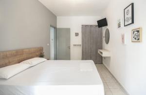Postel nebo postele na pokoji v ubytování Afkos Apartments