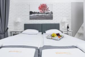 Posteľ alebo postele v izbe v ubytovaní Salomea Krakow apartments