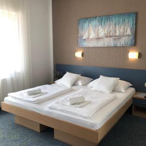 מיטה או מיטות בחדר ב-Rooms Ana