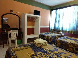 Postel nebo postele na pokoji v ubytování Hotel Real del Quijote a sólo 50 metros de la playa