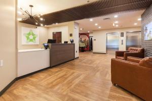 an office lobby with two chairs and a reception desk at Extended Stay America Premier Suites - Nashville - Vanderbilt in Nashville