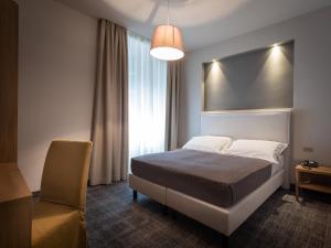 Cama o camas de una habitación en HNN Luxury Suites