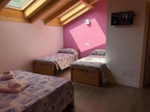 Postel nebo postele na pokoji v ubytování Hotel Mojito