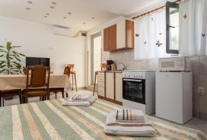 a living room with a kitchen and a dining room at Apartment Panorama in Kotor