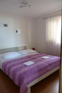 Postel nebo postele na pokoji v ubytování Apartments Čobanov
