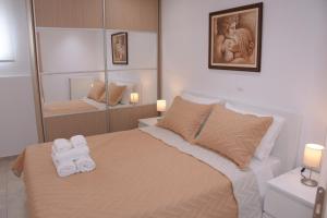 Posteľ alebo postele v izbe v ubytovaní Keratea Apartment Athens Airport