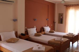 A bed or beds in a room at Atira Apartment Hotel