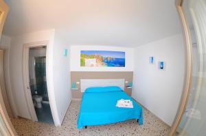 A bed or beds in a room at Le Sette Meraviglie