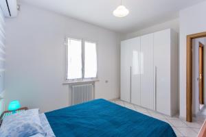 A bed or beds in a room at Residence Kimba