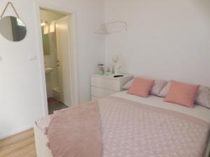 Postel nebo postele na pokoji v ubytování Apartman Karmen
