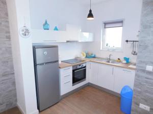 Kuchyň nebo kuchyňský kout v ubytování Apartman Karmen