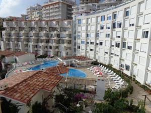 an aerial view of a hotel with a pool and buildings at Kela Apartments in Sarandë +80 photos