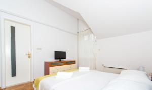 Postel nebo postele na pokoji v ubytování Mediterranean Blue Apartments