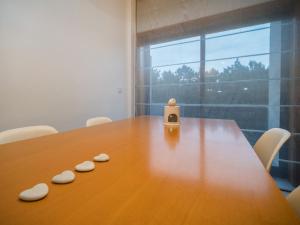 a wooden table with two cookies on top of it at Susanna in Viana do Castelo