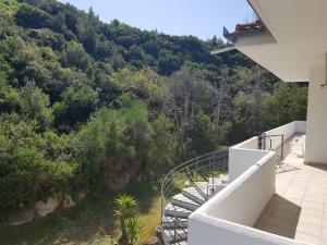 a staircase on a house with a view of a mountain at Christina's panoramic view appartment in Polychrono
