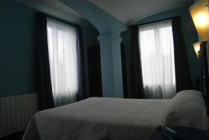 Cama o camas de una habitación en Hotel Los Laureles