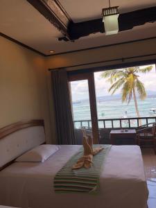 Postel nebo postele na pokoji v ubytování Padangbai Beach inn