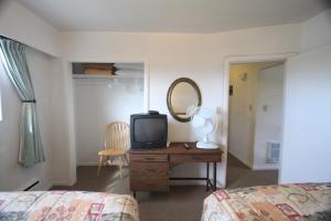 Postel nebo postele na pokoji v ubytování Sunset Motel