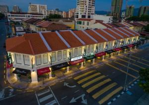 an overhead view of a city street with buildings at Macallum Central Hotel Managed by The Ascott Limited in George Town