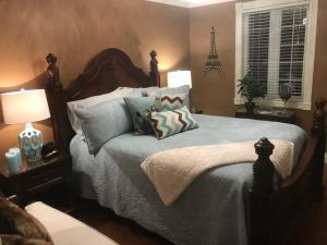 a bedroom with a large bed with pillows on it at Castle Landing in Placentia