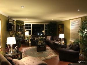 a large living room with couches and tables at Castle Landing in Placentia