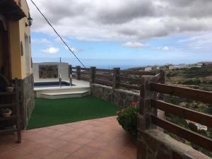 a balcony with a view of the ocean at Casa La Lomada in Telde