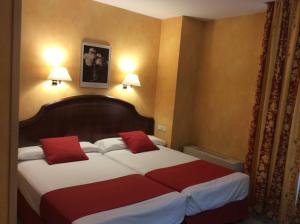 Postel nebo postele na pokoji v ubytování Hotel Cordón